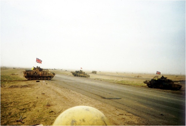 Mission accomplished. The Basra Rd by the UN deadline. D Squadron crosses the Basra Rd. Note that we had heard of the RRF Warrior which had been taken out by a US A-10 tank killing aircraft. We broke out the flags to deter further blue on blue air attacks 